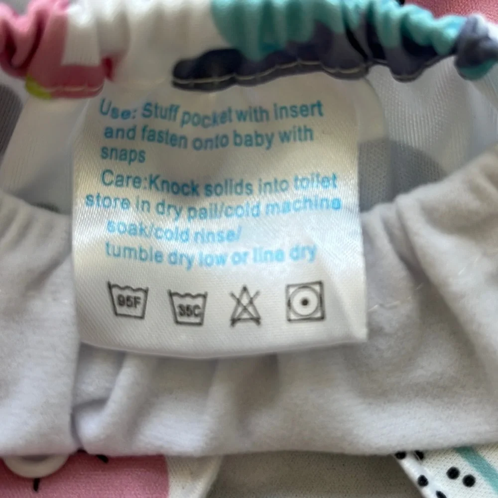 Adjustable, vinyl, disposable diapers with carry bag. Inserts bought separately.